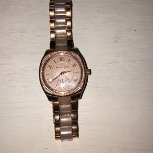 Michael Kors rose gold watch.